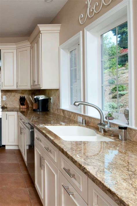 white cabinets with brown granite